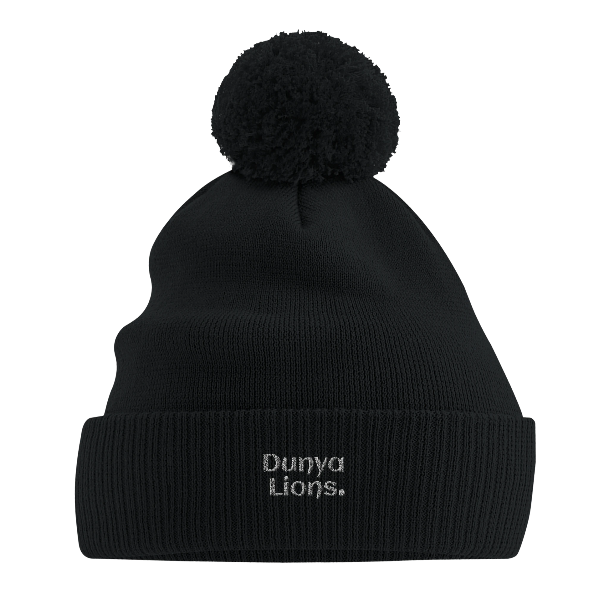 Front view of black pom-pom beanie with the bold “Dunya Lions.” embroidery — streetproof winter armor with silent presence and elite energy.